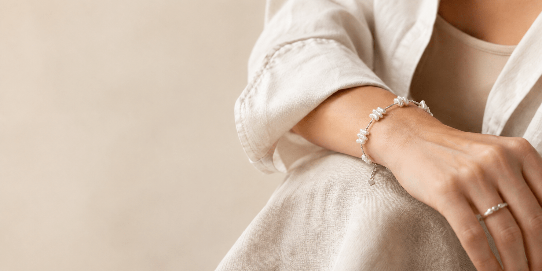 Natural stone bracelet worn with a comfortable fit on the wrist for the LUNARAE bracelet fit and styling guide.