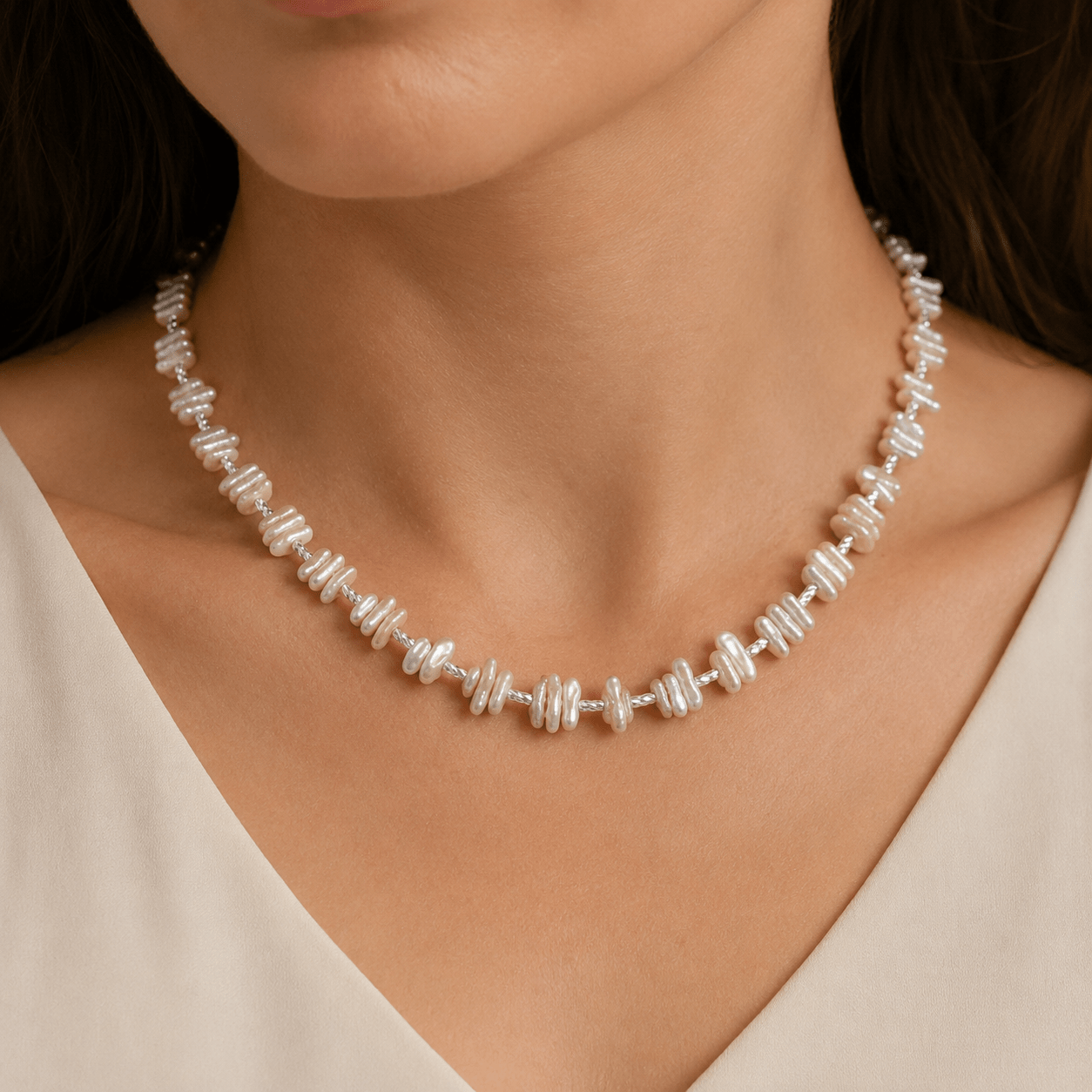 Baroque Pearl Necklace worn close to the collarbone with a white V-neck top
