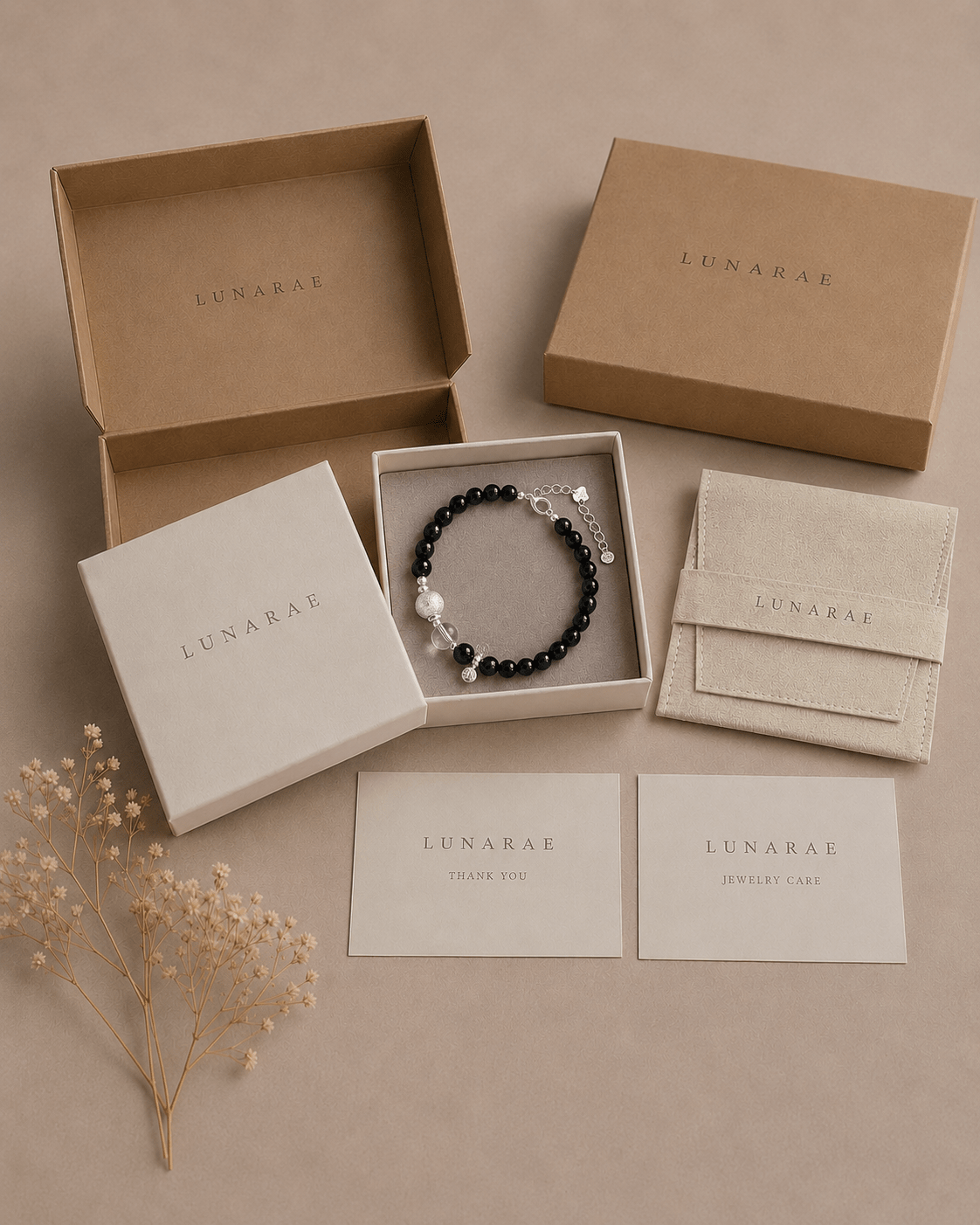 LUNARAE jewelry packaging with black onyx and clear quartz bracelet