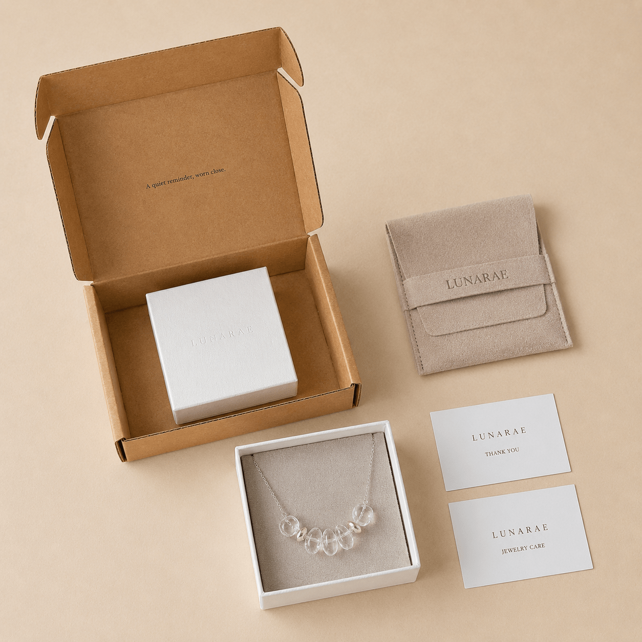 Clear Quartz Pendant Necklace presented with LUNARAE gift packaging including a jewelry box, pouch, mailer box, thank you card, and jewelry care card