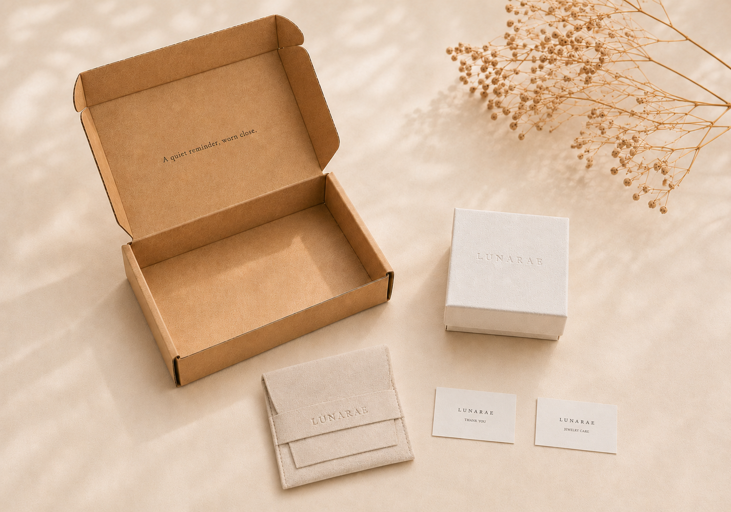 LUNARAE gift-ready jewelry packaging with kraft mailer box, ivory jewelry box, suede envelope pouch, thank you card, and jewelry care card