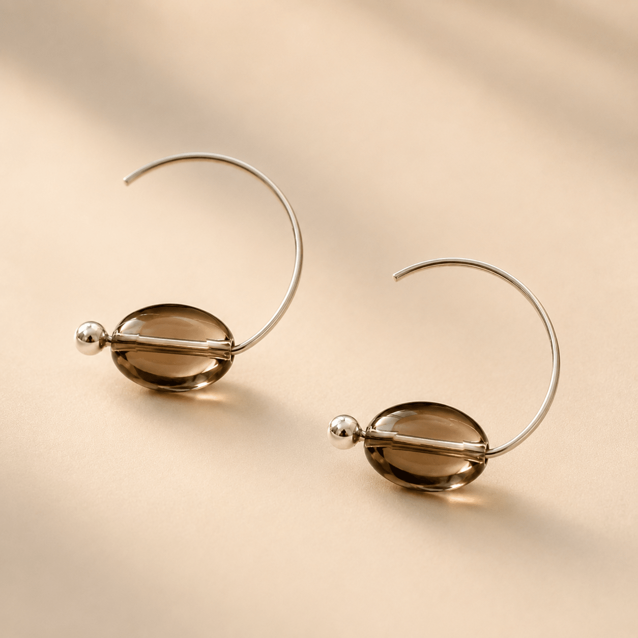 Smoky Quartz Hoop Earrings shown from an alternate angle, highlighting the open silver hoops and translucent brown quartz beads