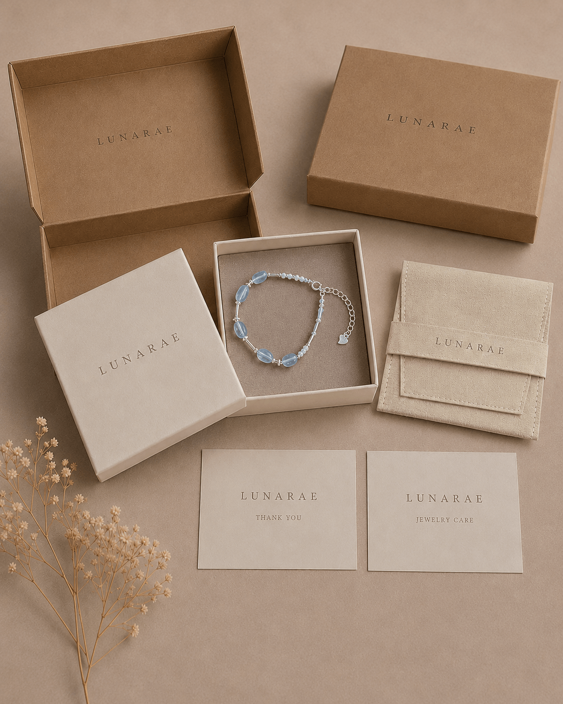 LUNARAE jewelry packaging with aquamarine and pearl bracelet