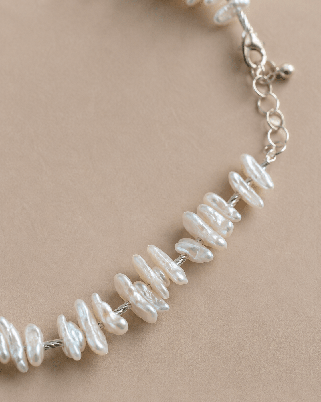 Close-up of baroque pearl and sterling silver details by LUNARAE