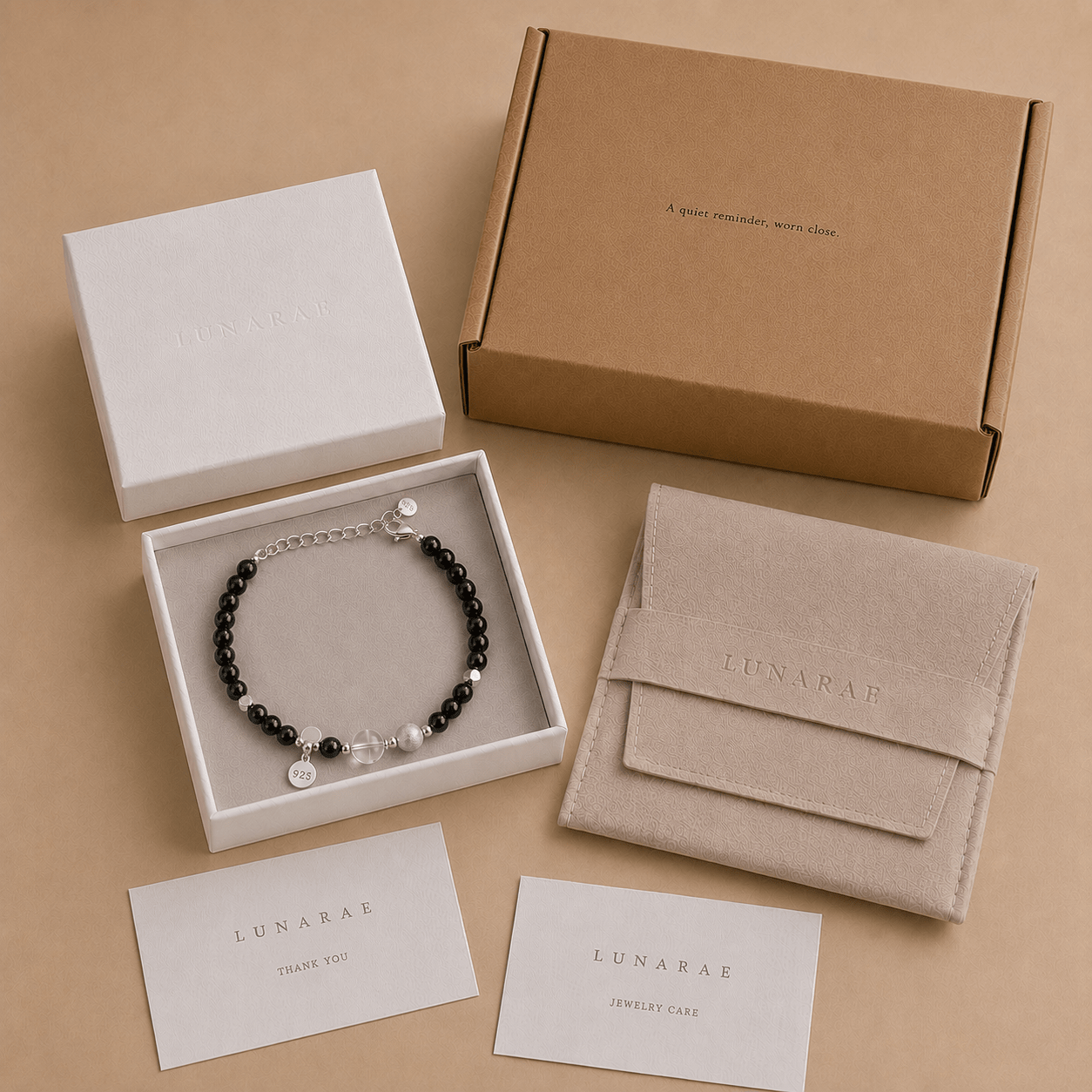 Black Onyx and Clear Quartz Bracelet presented in a LUNARAE jewelry box with a pouch, thank you card, jewelry care card, and outer mailer box