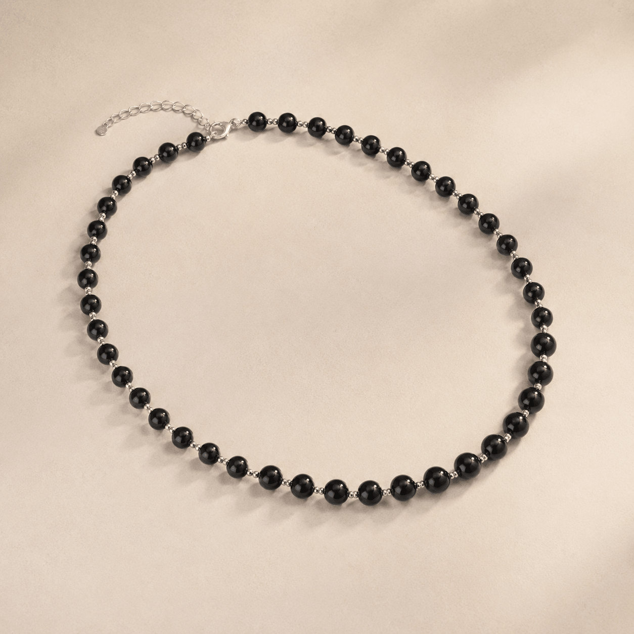 Black Onyx Bead Necklace shown from an alternate flat-lay angle with the extender chain visible