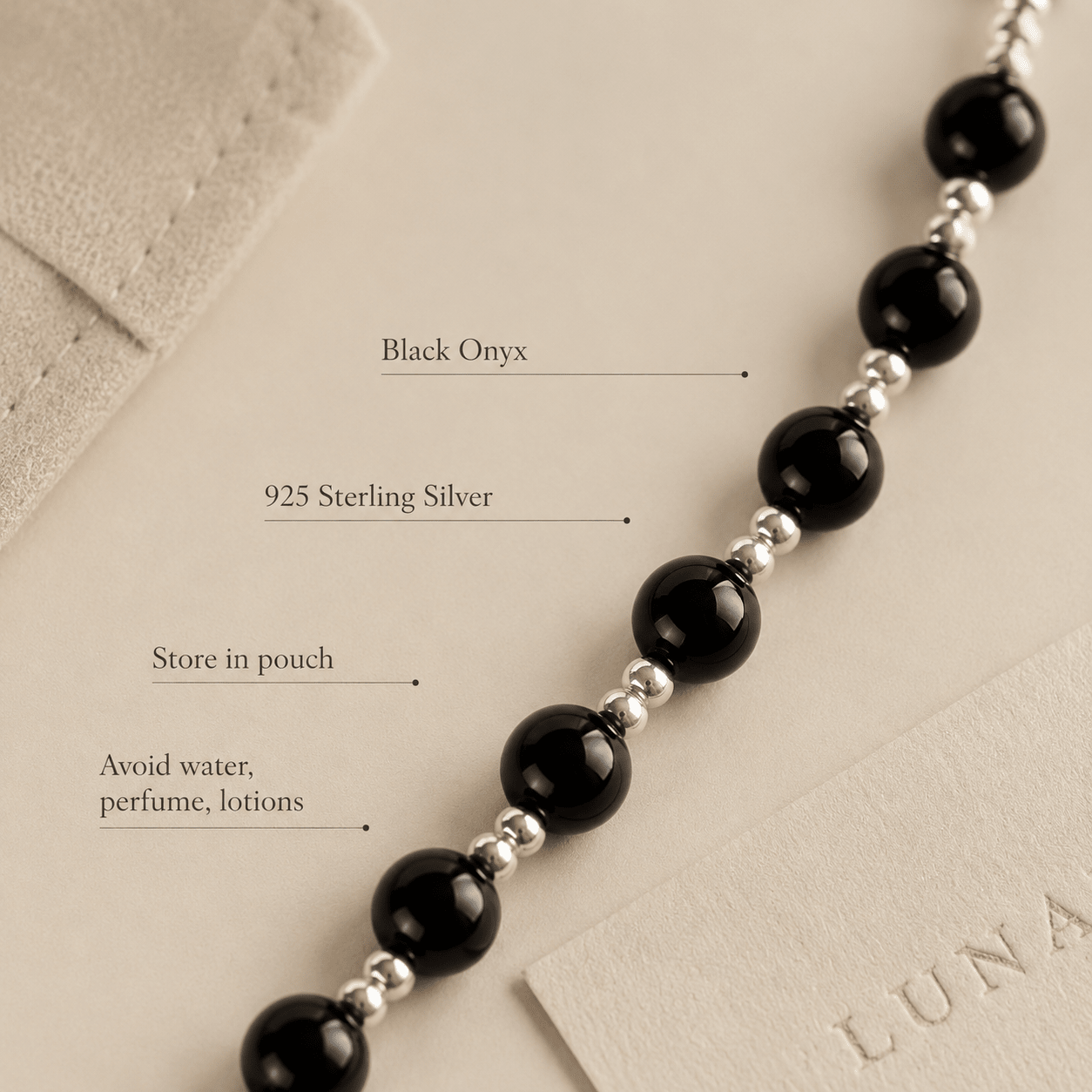 Close-up of the Black Onyx Bead Necklace with text highlighting black onyx, 925 sterling silver, and storage and care guidance