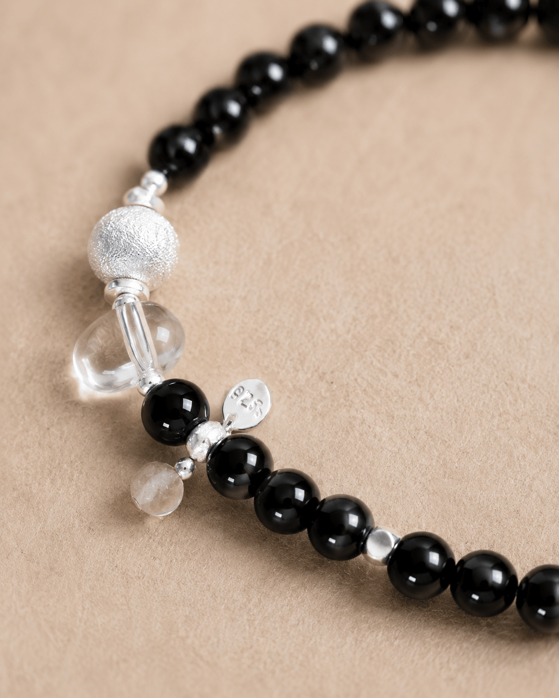 Close-up of black onyx, clear quartz and sterling silver details by LUNARAE