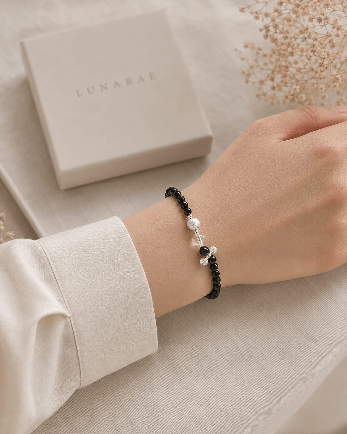 Model wearing Black Onyx and Clear Quartz Silver Bracelet by LUNARAE