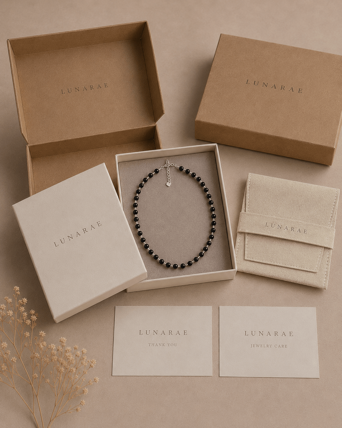 LUNARAE jewelry packaging with black onyx necklace