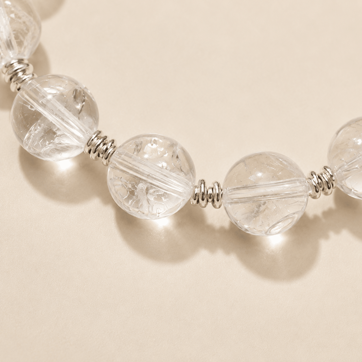 Close-up of the Clear Quartz Silver Bead Bracelet showing the natural inclusions of the clear quartz beads and sterling silver spacer details