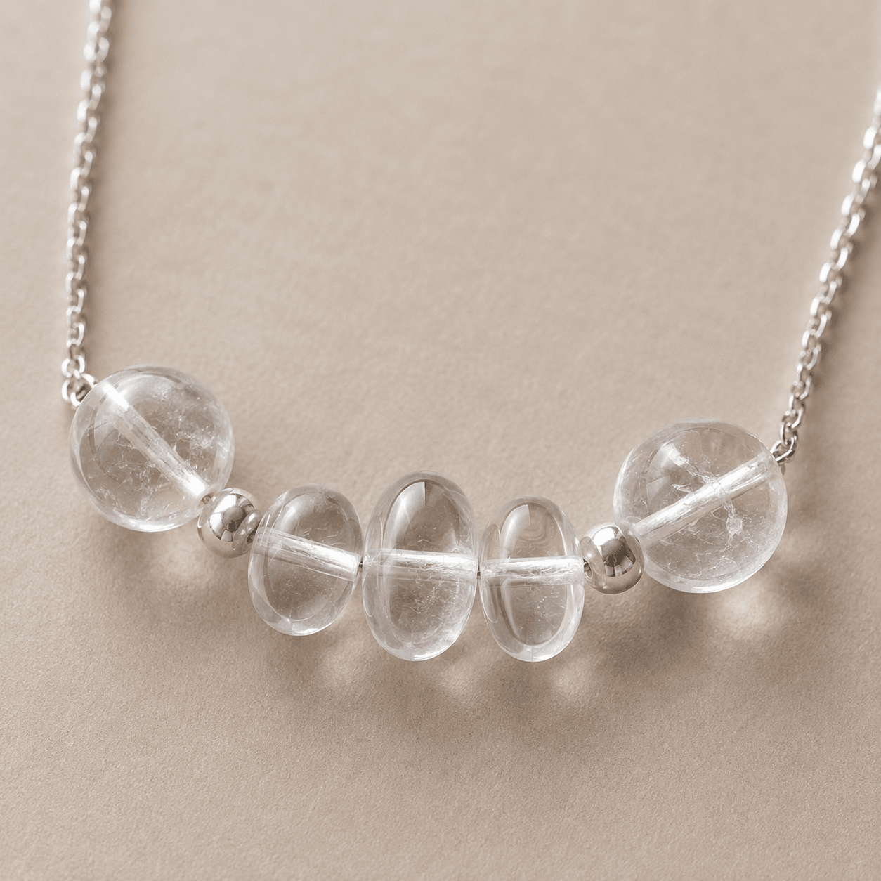 Close-up of clear quartz and sterling silver necklace details by LUNARAE