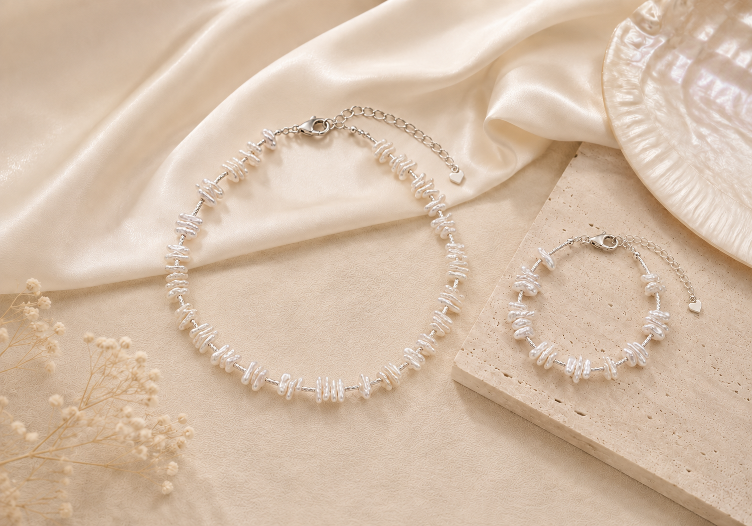 Baroque pearl necklace and baroque pearl bracelet styled in a soft neutral still life for the LUNARAE Grace collection.