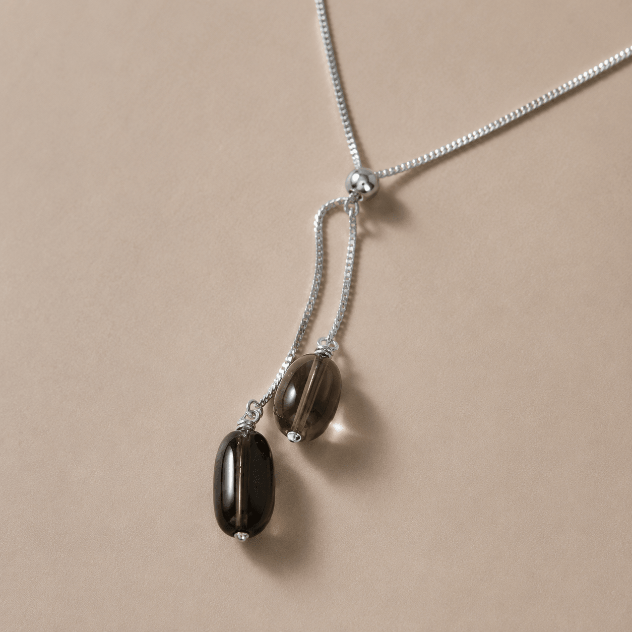 Close-up of smoky quartz and sterling silver necklace details by LUNARAE